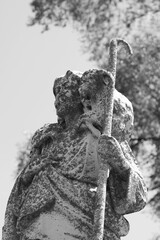 Poster - A statue of Jesus Christ holding a lamb in black and white.