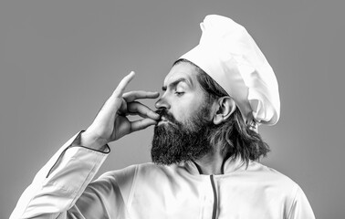 Chef, cook making tasty delicious gesture by kissing fingers. Cook hat. Black and white