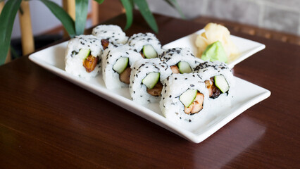 Wall Mural - Sushi roll with chicken and vegetables served in a Tokyo restaurant.