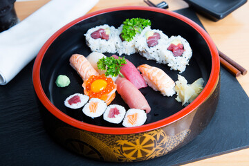 Wall Mural - Set of sushi with variety of makis, nigiris and sashimi with fine fish like salmon and tuna.