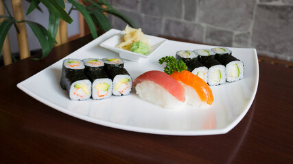 Wall Mural - Set of sushi with variety of makis, nigiris and sashimi with fine fish like salmon and tuna.