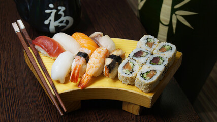 Wall Mural - Set of sushi with variety of makis, nigiris and sashimi with fine fish like salmon and tuna.