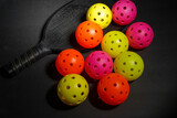 Fototapeta Dziecięca - pickle balls and racquet on black background