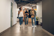 © zinkevych - Office workers having a conversation in the company corridor