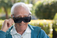 Portrait Of A Senior Man Wearing Cataract Dark Glasses