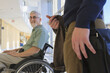 © Designpics - Professor with Muscular Dystrophy in a university hallway with a student