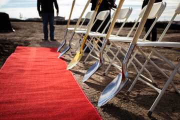 construction ground breaking ceremony with red carpet
