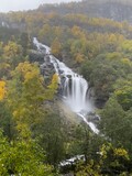 Fototapeta Tęcza - Large waterfalls flowing down to the fjords in autumn in Norway