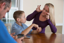 Mother Communicating With Son In American Sign Language 'Can You Hear' At Home
