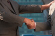 © Designpics - Businessmen shaking hands