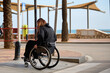 © Lari Jarnefelt - Woman in wheelchair crossing the street in Fuengirola Spain