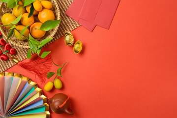 Chinese New Year celebration with traditional decorations for Spring festival on red background. Top view, flat lay