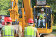 © Designpics - Heavy construction equipment operator in excavator