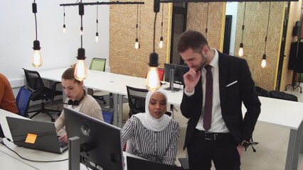 Web design team discussing a website solution in coworking startup office