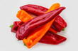 © Designpics - Fresh red and orange peppers on a white background; Studio