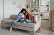 © DimaBerlin - Depressed unhappy teenage girl experiencing stress after getting bad grades at school or quarrel with classmates. Loving caring woman calms upset child hugging daughter sits on sofa in apartment