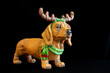 Christmas dog with antlers on black background