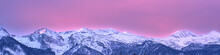 Banner 4:1 With A Mountain Landscape At Dawn. Rays Of The Rising Sun Illuminate The Peaks Of The Mountains With An Unusual Bright Pink Color