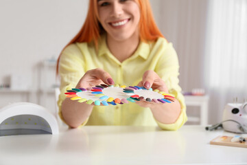 Poster - Transgender manicure master with nail polish tips at table in salon, closeup