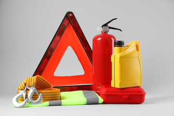 Set of car safety equipment on light grey background