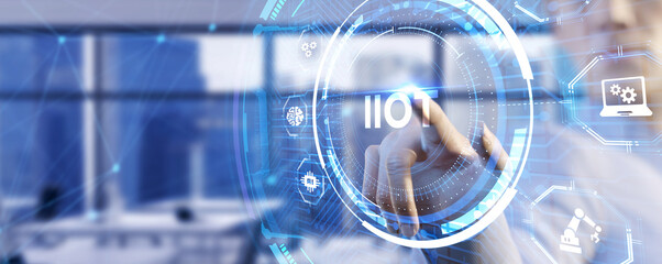 Internet of things - IOT concept. Businessman offer IIOT products and solutions. The future of technology. Virtual screen of the future with the inscription: IIOT.