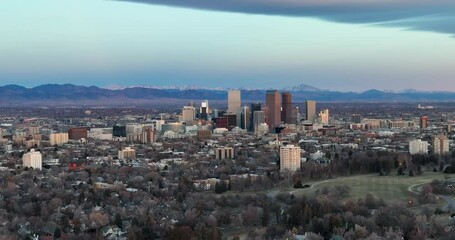 Canvas Print - Aerial panorama of Denver downtown skyline in the winter season, snowy mountains in background