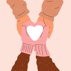 Hands in mittens hold a heart made of snow. Love, Valentine's Day.	