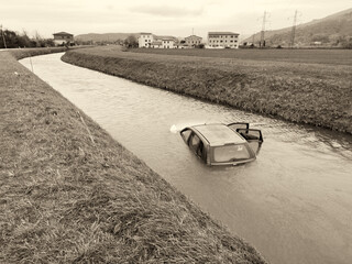 Wall Mural - Damaged Car flooded in the river - Flood Disaster