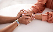 Hands, Women And Holding Closeup In Support Of Comfort, Empathy And Unity In Crisis, Cancer Or Bad News. Hand, Zoom And Friends Holding Hands For Hope, Trust And Prayer For Girl Suffering Depression