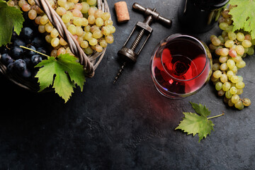 Wall Mural - Red wine glass and grape in basket