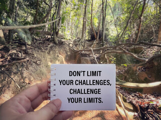Wall Mural - Motivational and inspirational wording. Don’t Limit Your Challenges, Challenge Your Limits. Wording written on blurred vintage background.