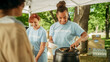 © Gorodenkoff - Group of Volunteers Preparing Free Food Rations for Poor People in Need. Charity Workers and Members of the Community Work Together. Concept of Giving, Humanitarian Aid and Society.