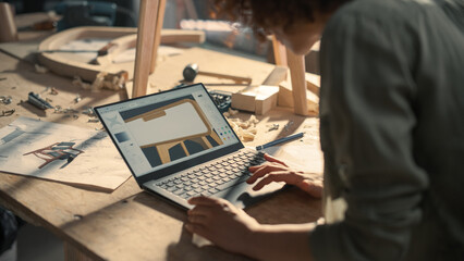 Close Up Shot of a Furniture Designer Working on Laptop Computer, Creating a Digital 3D Model of a Stylish Wooden Bedside Table. Creative Person Preparing a Design for Carpentry Project on a Screen.