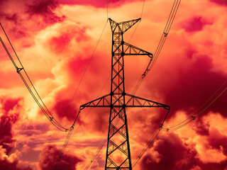 Wall Mural - High voltage electricity power line towers against the sky.  Red cloudy apocalyptic sky.