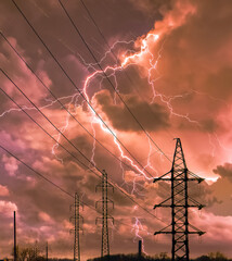 Wall Mural - High voltage electricity power line towers against thunderstorm sky.  Transmission towers