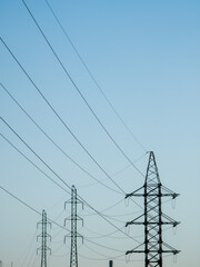 Wall Mural - High voltage electricity power line towers against the sky.  Transmission towers