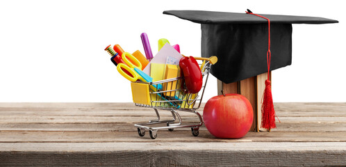 Wall Mural - Graduation hat with colorful supplies on desk