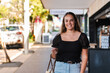 © Austockphoto - young woman walking in an urban setting