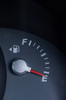© Austockphoto - Expensive petrol concept rising cost of living - petrol gauge indicator on empty
