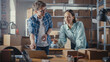 © Gorodenkoff - Positive Young Male and Female Working in Warehouse. Talking, Using Laptop Computer, Checking Retail Stock, Preparing Shipment. Successful Small Business Owners High Five Each Other.