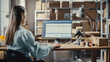 © Gorodenkoff - Woman Using Desktop Computer with a Display. Distribution Manager and Employee Working in Distribution Warehouse with Cardboard Boxes. Over the Shoulder Footage.