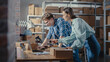 © Gorodenkoff - Two Employees Preparing Orders Made from Online Sales in Their Internet Shop. Man and Female Working in a Storeroom. Young Woman Using Laptop Computer, the Man Packing Boxes with Items. Rack Focus.