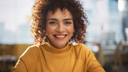 Aufkleber - Portrait of an Attractive Arab Female in Creative Agency. Young Stylish Manager with Curly Hair Smiling, Looking at Camera. Manager Working in Modern Company.