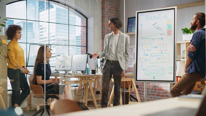 Aufkleber - Young Businessman Leading a Team Meeting in Creative Office Conference Room. Confident Stylish Manager Showing Project Plan Presentation on Digital Whiteboard Monitor