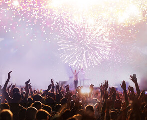 Wall Mural - fireworks display and crowd celebrating happy new year