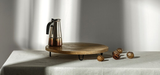 Minimalist interior with a table and a shadow on the wall, a lift with fresh coffee