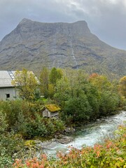 Wall Mural - The landscape of a village with river and mountain in autumn in Norway