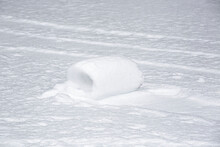 Snow Roller In A Field Caused By Ideal Weather Conditions And The Wind; Shefford, Quebec, Canada