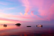 © Designpics - Sunrise over the South Pacific with boats anchored off the shore; Malolo Island, Fiji