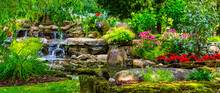 Landscaped Flower Garden In Bloom With Water Feature In A Yard; Hudson, Quebec, Canada